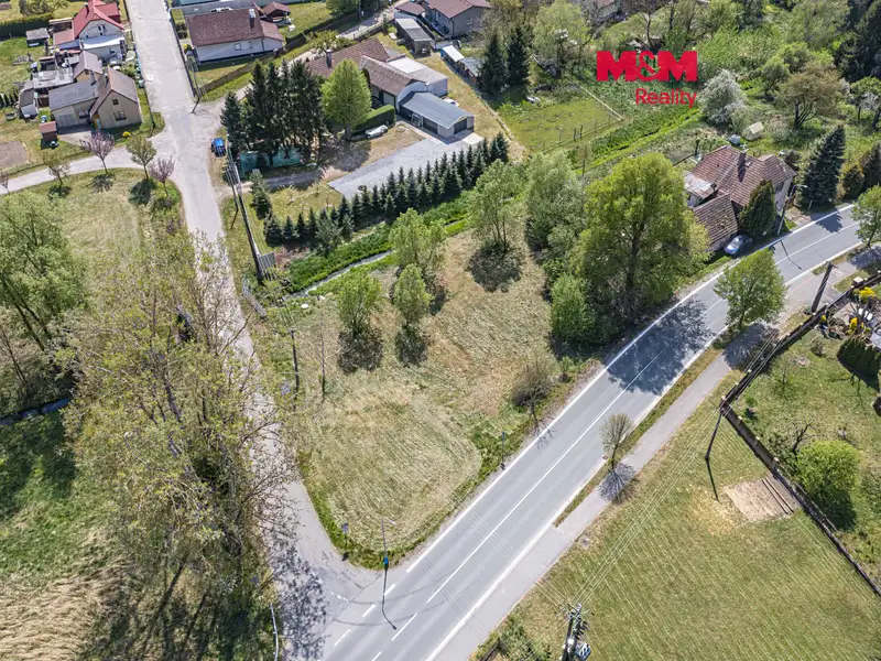 Prodej stavebního pozemku 1402 m², Veliny – náhled fotky 1