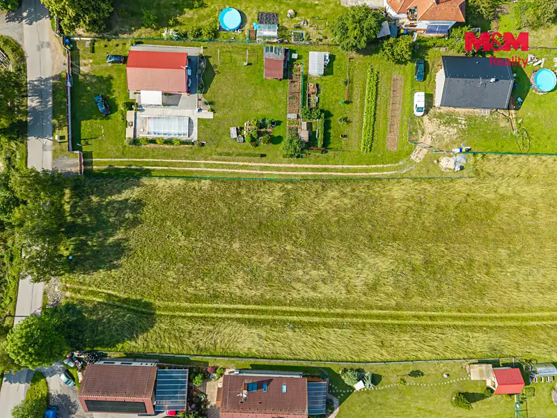 Prodej stavebního pozemku 1100 m², Hrusice – náhled fotky 2